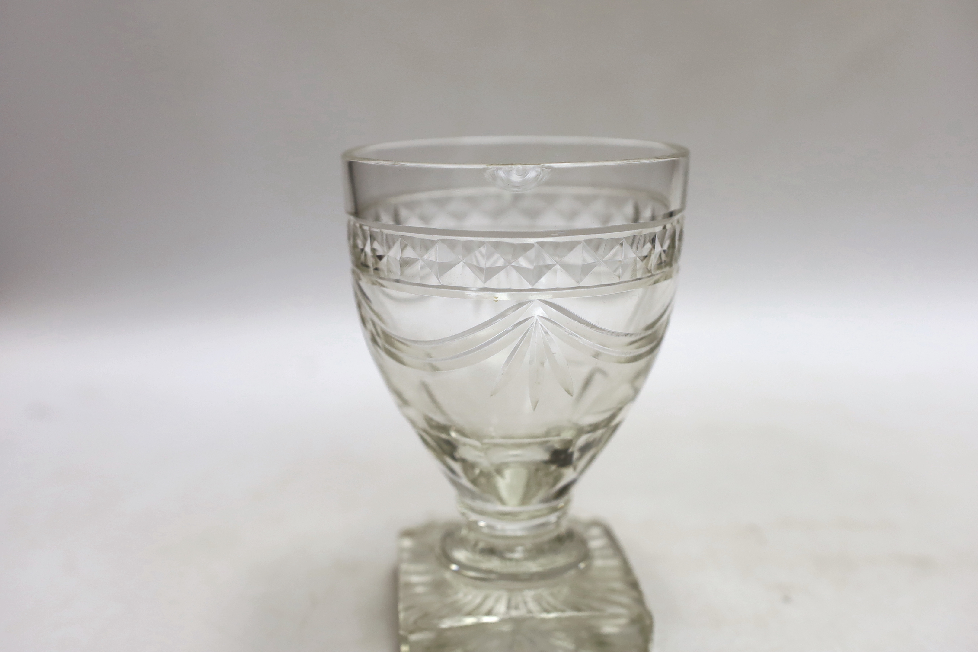 Three late 19th early 20th century square base wine glasses, three similar etched glasses and another (8)